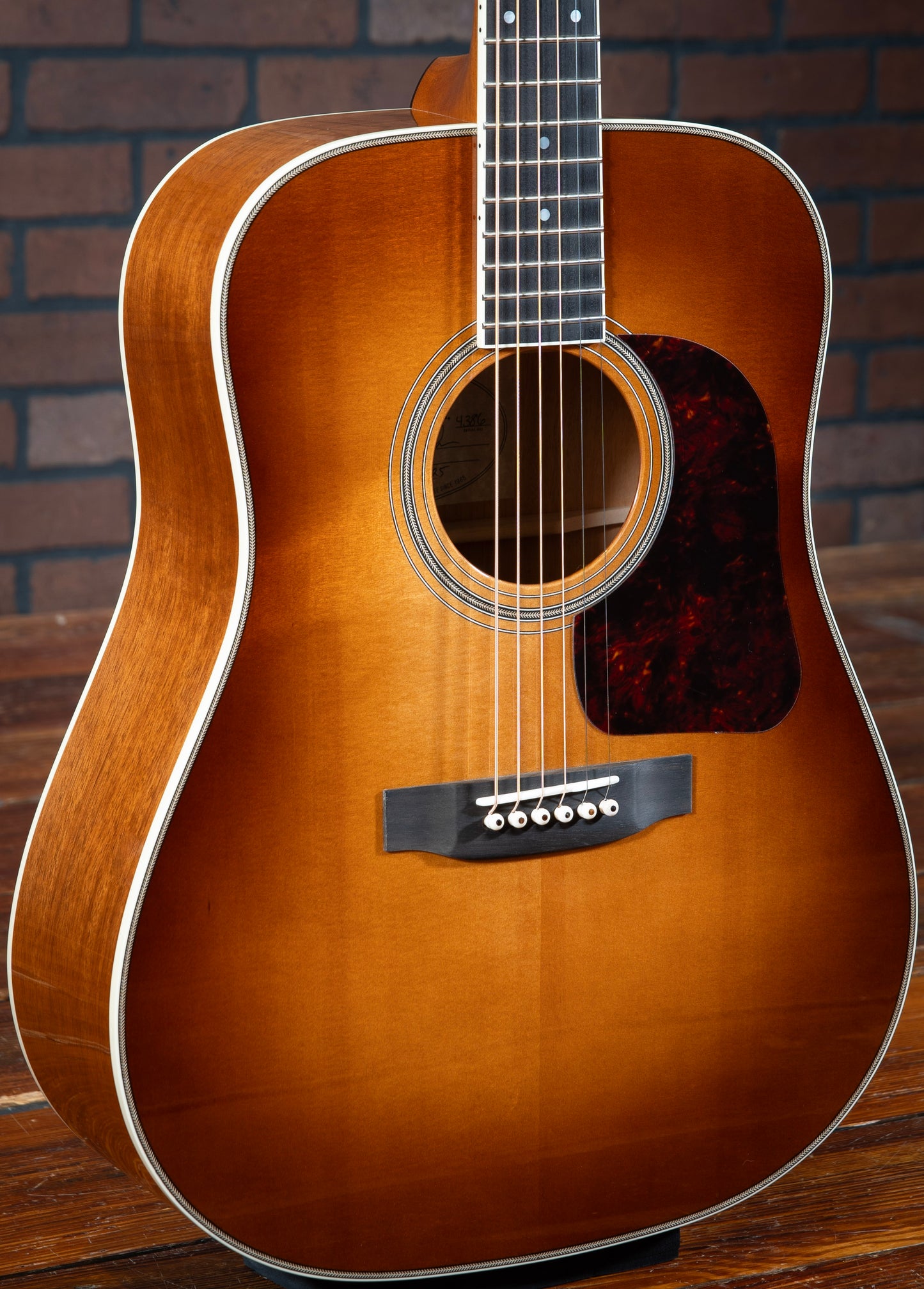 Gallagher Doc Watson Model acoustic guitar with Sitka spruce sunburst top and Mahogany sides, and ivoroid binding.