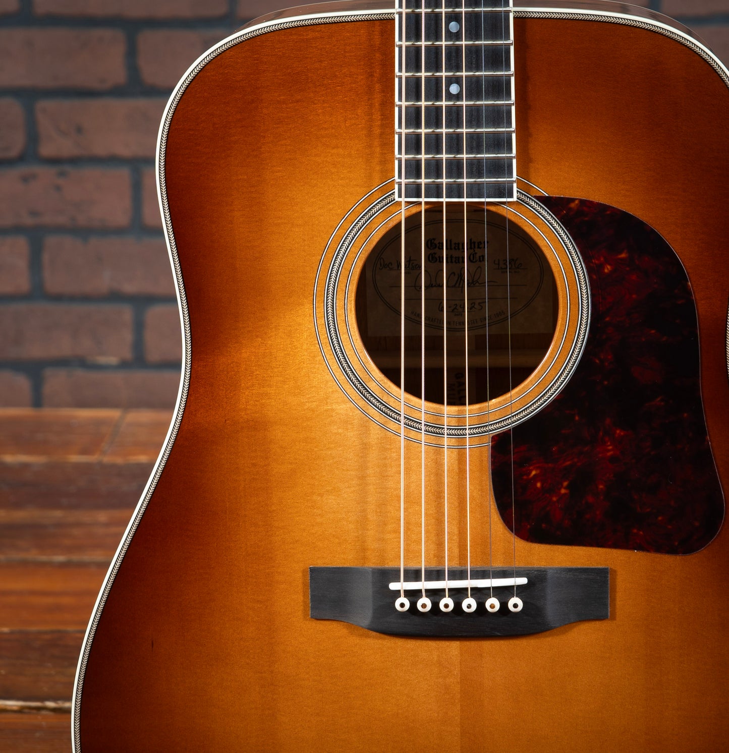 Gallagher Doc Watson Model acoustic guitar with custom sunburst, herringbone rosette and purfling, and ivoroid binding.