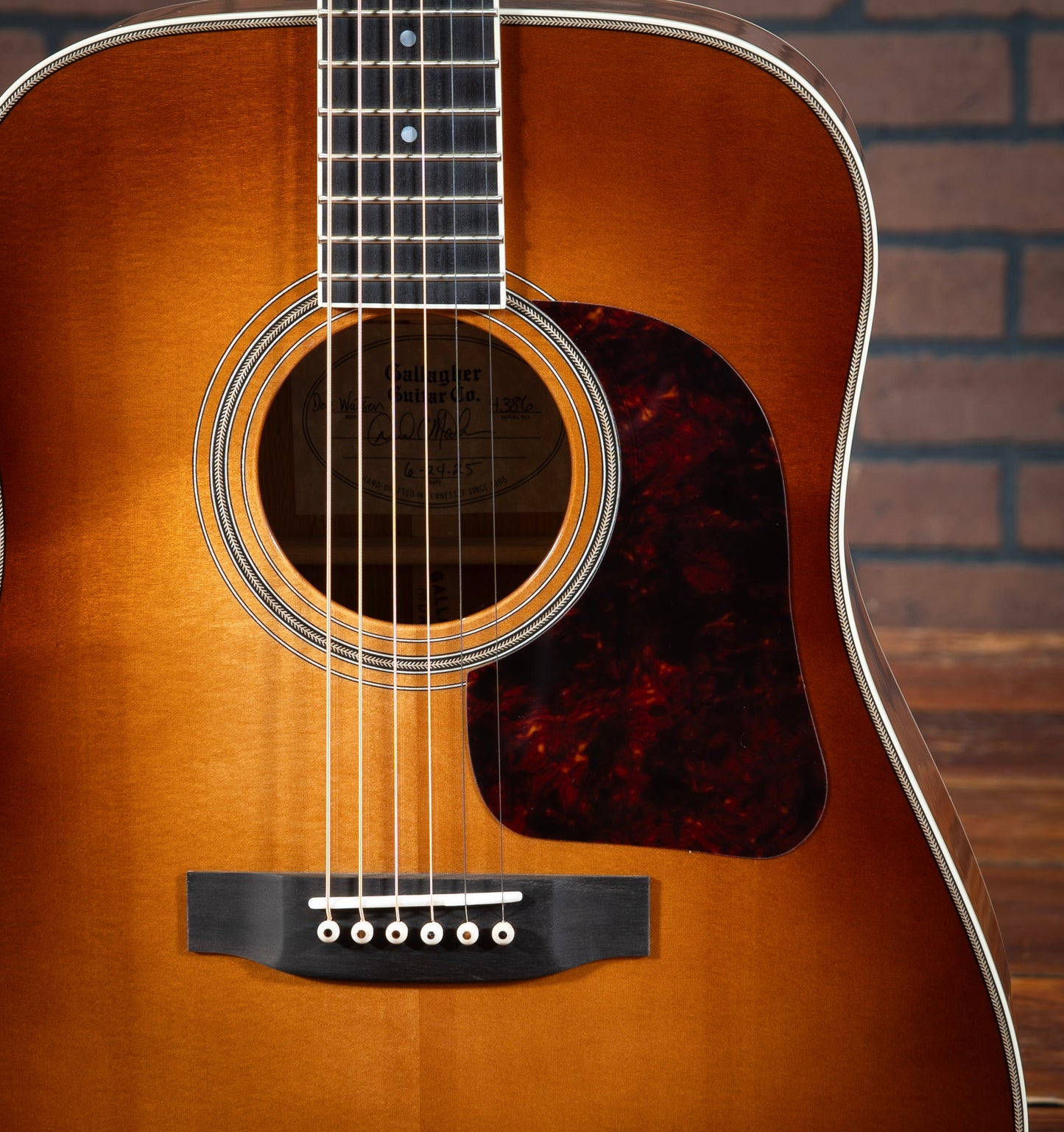 Gallagher Doc Watson Model acoustic guitar with herringbone purfling, custom sunburst, 3 ring herringbone rosette, and ivoroid binding.