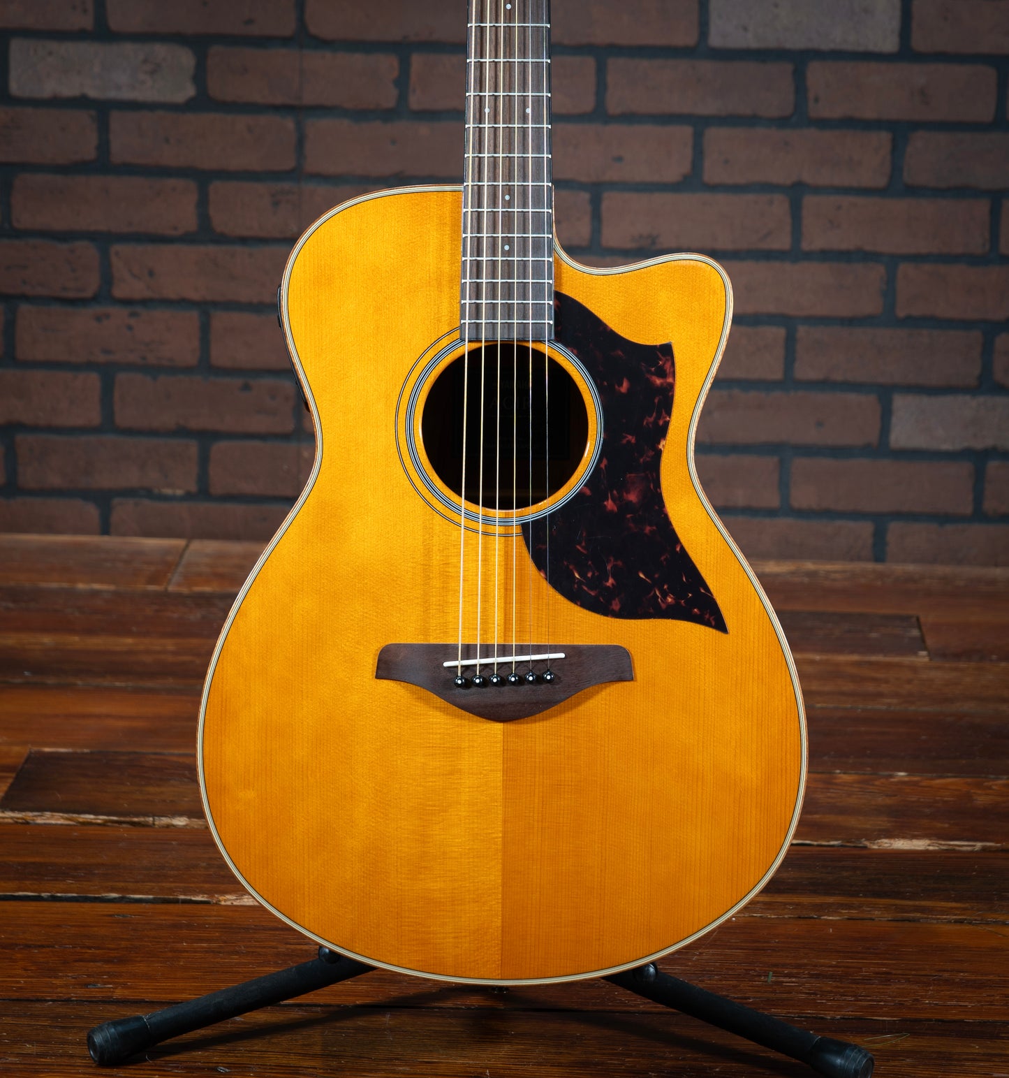 Yamaha AC1R acoustic electric guitar with scalloped bracing, concert cutaway body, and gloss finish