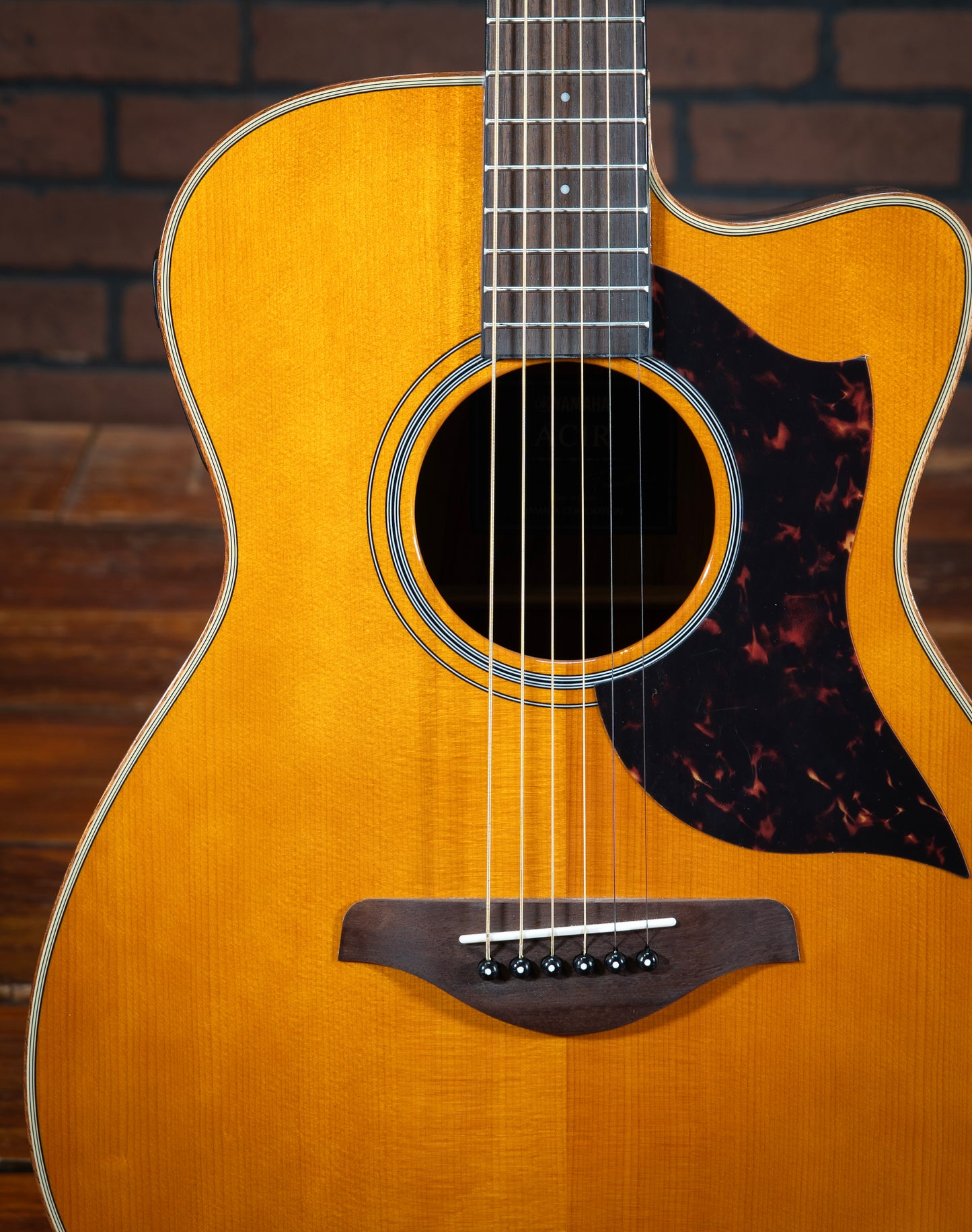 Yamaha AC1R acoustic electric guitar with tortoise pickguard, black and white rosette inlay