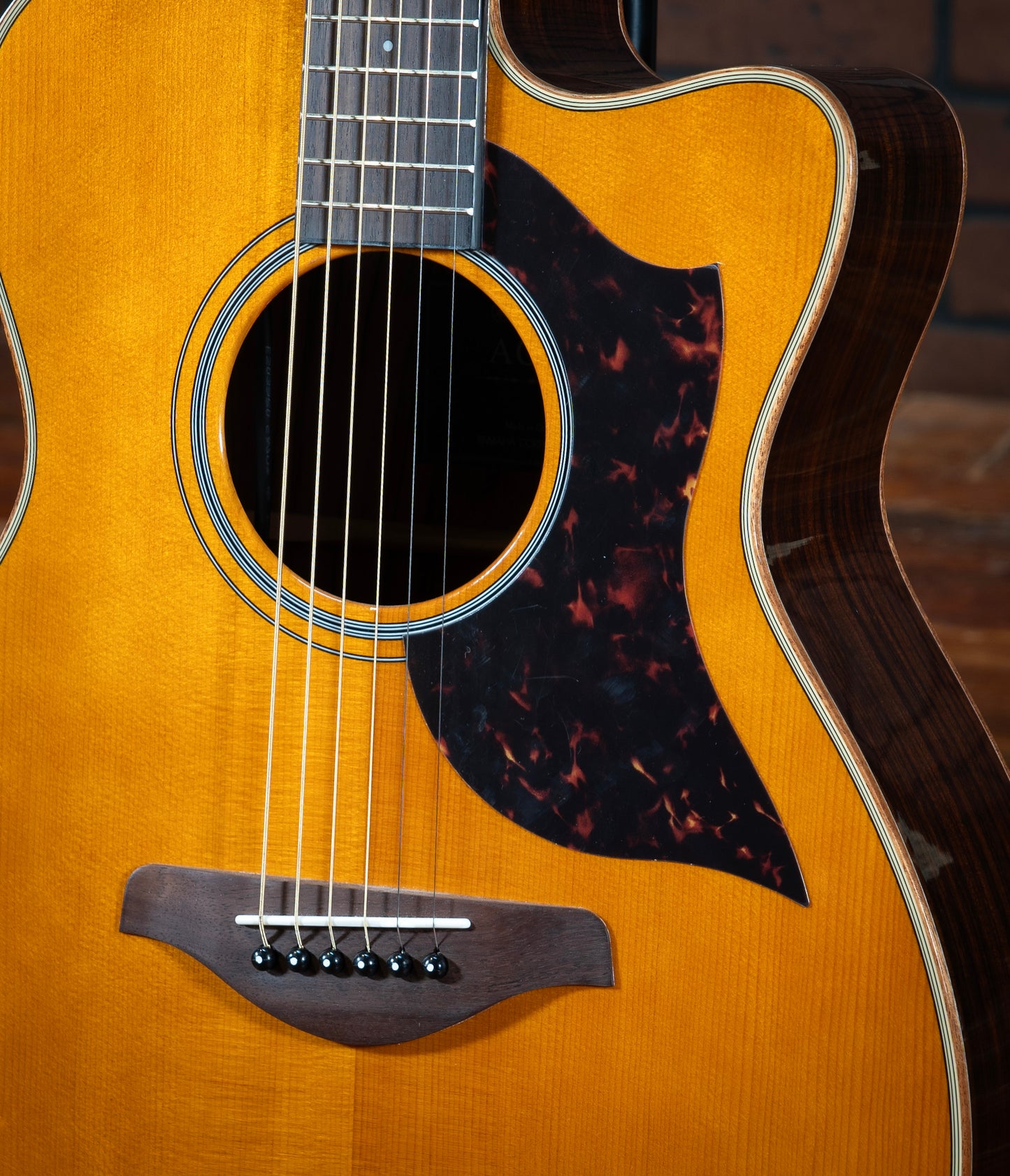 Yamaha AC1R acoustic electric guitar with mahogany and white binding and rosewood sides